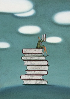 Images Dated 20th May 2015: Schoolboy Sitting on a Stack of Books Reading