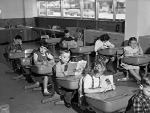 Schoolchildren Sitting at Their Desks