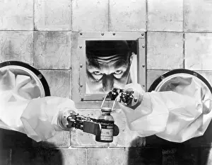 Risk Prints: Scientist Bottling Radioactive Isotopes
