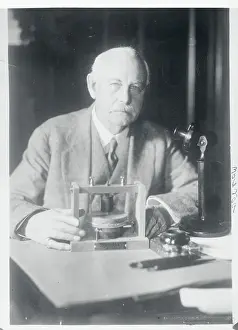 Scientist Charles J. Bell Working with Equipment