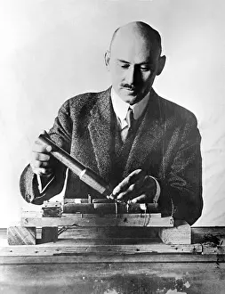 Scientist Displaying Moon Rocket