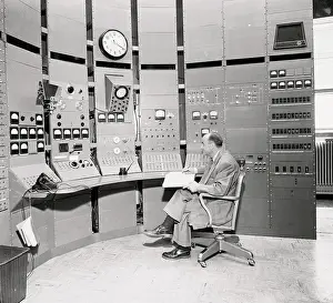 Scientist Sitting in Atomic Control Room