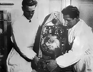 Scientist Working with Sputnik Compartment