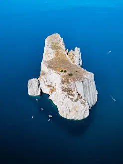 Prints of Scoglio Pan di Zucchero, rock island in the mediterranean sea. Sardinia, Italy Sardinia (Italian Sardegna) Island Prints: Scoglio Pan di Zucchero, rock island in the mediterranean sea