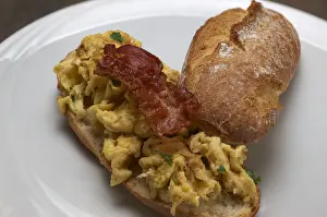 Meal Prints: Scrambled eggs with fried bacon on a rustic roll