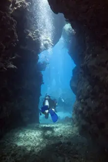 Actions Prints: Scuba diver leaving a cave, Marsa Alam, Red Sea, Egypt, Africa