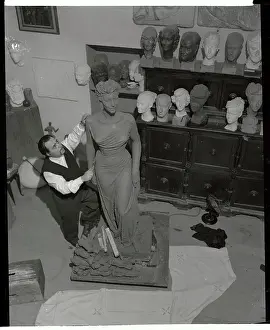 Sculptor Fashioning a Statue of Ava Gardner