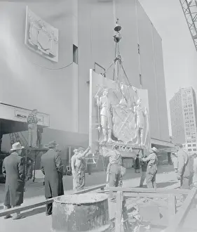 Seal of the City of New York Being Hoisted Onto the New York Coliseum