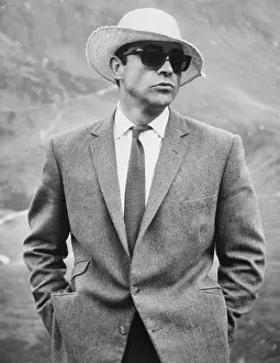 Sean Connery Wears Straw Hat and Sunglasses