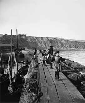 Prints of circa 1870: Children playing on a pier against a steep shoreline. (Photo by London Stereoscopic Company/Getty Images) A fascinating collection of images featuring great British piers: Seaside Holiday