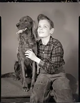 Seated Boy with Dog
