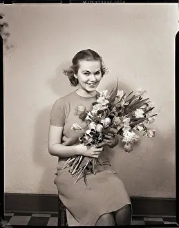 Seated Girl Holding Flowers