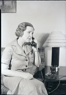 Seated Woman Using Telephone