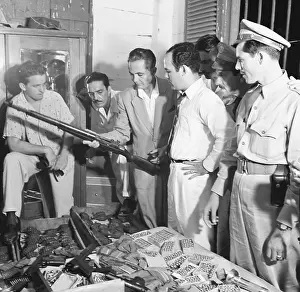 Secret Service Men Examining Weapons