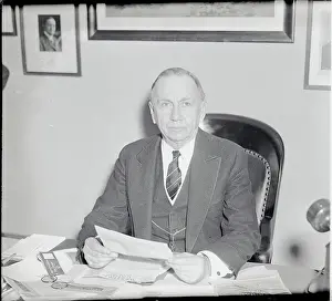 Secretary of Commerce Daniel C. Roper with Document at His Desk