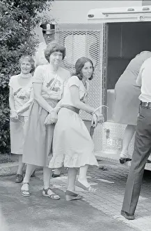 Security Leading Women Into Police Van