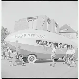 Seehasen Parade with Youngsters in and Towing Zeppelin Float