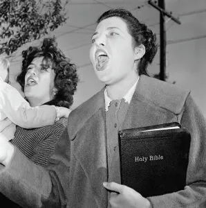 Screaming Prints: Segregationist Yelling and Holding Bible