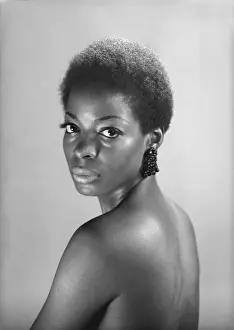Semi dress woman posing in studio, (B&W), portrait