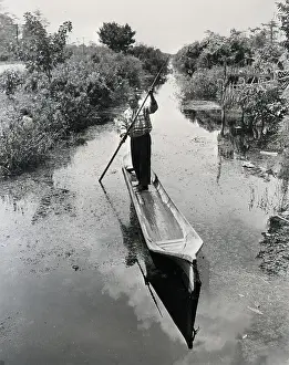 Spear Prints: Seminole Indian Poling Canoe in Canal