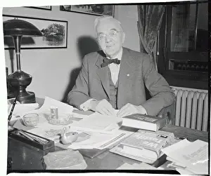 George W Prints: Senator George W. Norris Seated at Desk
