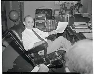 Senator John McClellan Reclining in Chair with the Press