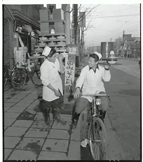 Senichi Okashita Carrying Tower of Noodle Bowls