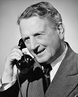 On The Phone Prints: Senior man on phone, (B&W), close-up