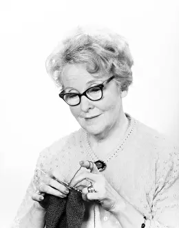 One Senior Woman Only Prints: Senior woman knitting