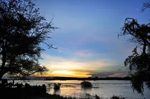 Serene view overlooking The Victoria Falls in Zambia at sunset