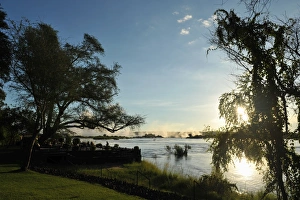 Serene view overlooking The Victoria Falls in Zambia at sunset