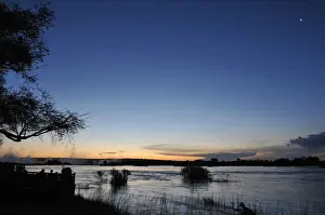 Serene view overlooking The Victoria Falls in Zambia at sunset