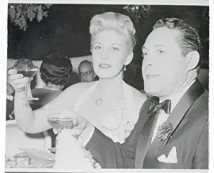 Serge Rubinstein and Betty Reed Making to a Toast