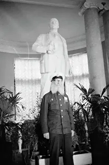 Vladimir Ilich Lenin Prints: Sergeyevich Vinogradsky Posing in Front of a Statue of Lenin