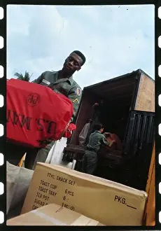 Servicemen Unloading a Van