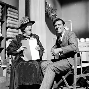 Prints of 30th January 1954: British slapstick comedian, Norman Wisdom, sharing a joke on set of his debut film, Trouble In Store' Master of Mime, Icon of Cinema: Chaplin in Prints: On Set Laugh