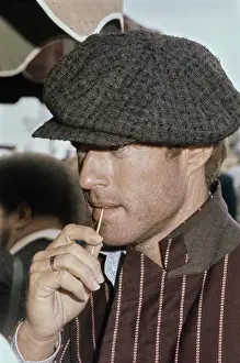 Prints of American actor Robert Redford wearing a striped brown jacket and a grey newsboy cap, holds a toothpick in his mouth, on the set of The Sting, filmed in the United States, 1973 Robert Redford: Classic Hollywood Elegance: On The Set Of The Sting