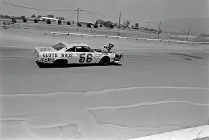 Prints of The Ford Fairlane, with Lloyd Bros Ford with Frank Capua, 56 written on the door, driven by American actor Paul Newman, a movie camera mounted on the hood, driving on the set of Winning Paul Newman: A Life in Frames: On The Set Of Winning