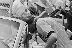 Prints of American actor Paul Newman kisses his wife and co-star, American actress Joanne Woodward, who sits in a car, on the set of Winning, filmed at the Riverside International Raceway in Moreno Valley Paul Newman: A Life in Frames: On The Set Of Winning