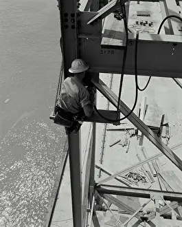 Setting in high tension bolts on steel construction of at New Orleans Grain Elevator unloading tower in New Orleans Louisiana