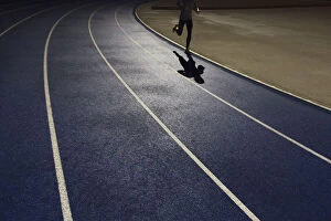 Images Dated 3rd February 2016: Shadow of a runner on a running track