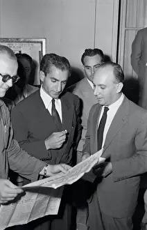 Shah Mohammed Pahlevi Reading a Report