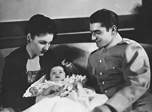 Shah and Queen of Iran Pose with Their Child