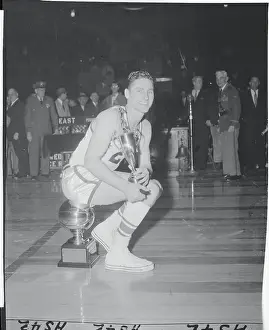 Bill Sharman Posing With His Trophies