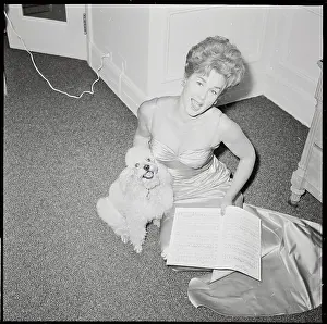 Sheila Reynolds Sitting with Music Score and Pet Poodle