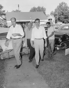 Milam Prints: Sheriff Escorting Murder Suspects to a Courthouse