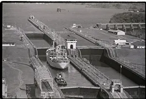 Ship and Tugboat in Miraflores Locks