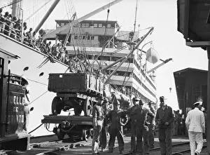 Unloading Prints: Ship Unloading American Weapons