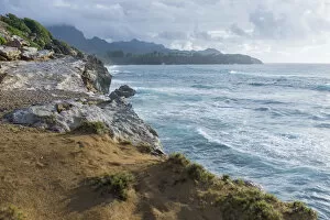 Cloudy Sky Collection: Shipwreck Beach leads to the Makawehi Lithified Cliffs, Kauai, Hawaii, USA