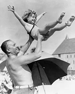 Shirley Temple with Father at Santa Monica Beach Print. Art Prints